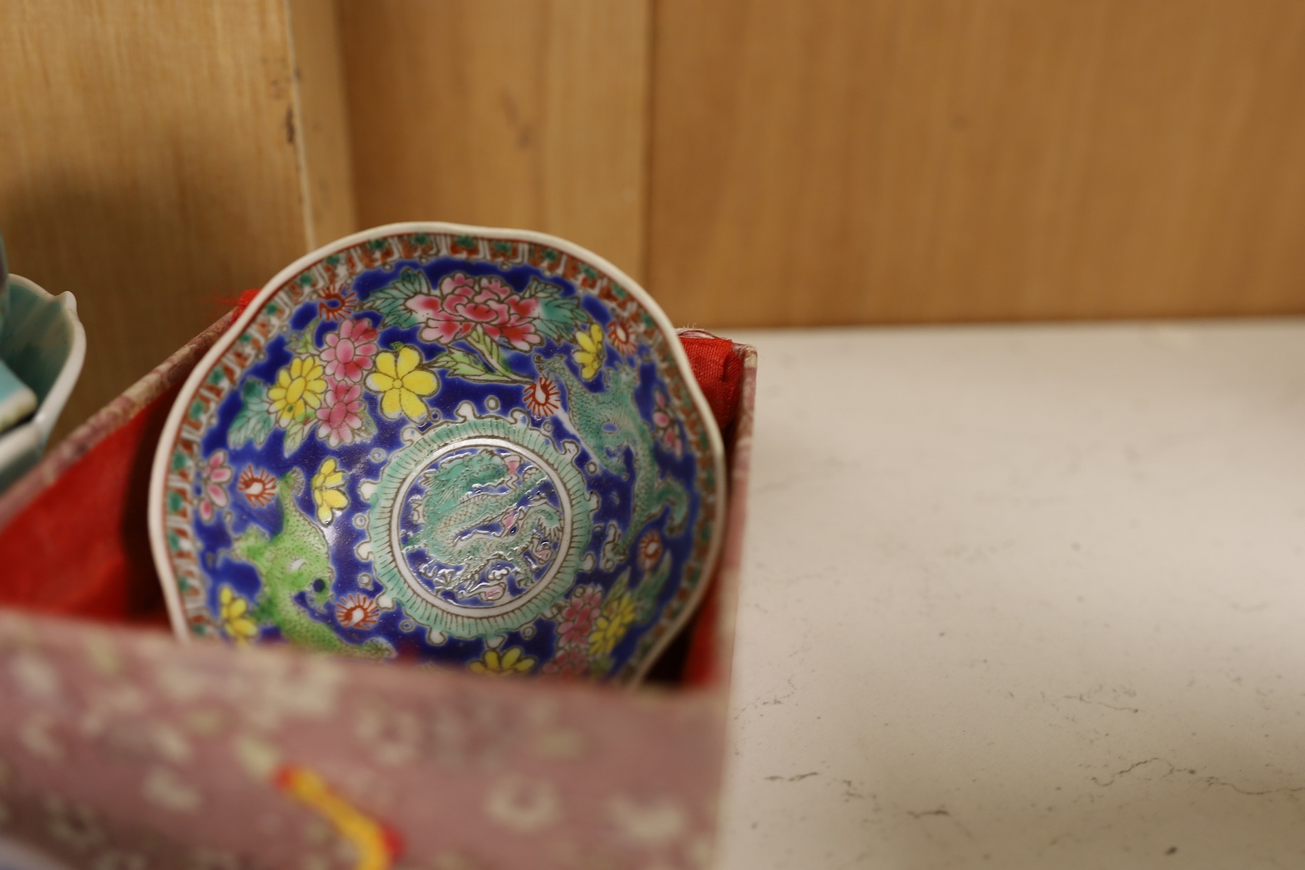 A pair of Chinese enamelled porcelain bowls, an eggshell bowl and a blue and white dragon bowl, turquoise bowls 11cm diameter (4). Condition - fair